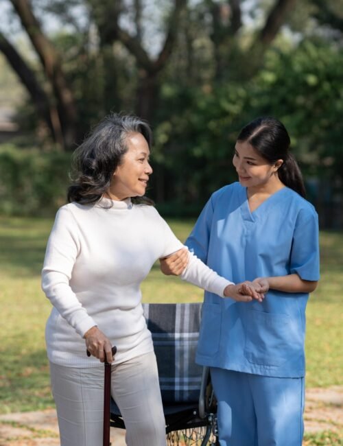 old-lady-smiling-at-her-nurse-while-the-nurse-is-t-2023-11-27-05-09-11-utc-min